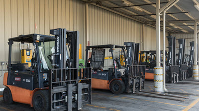 Row of forklifts at a warehouse